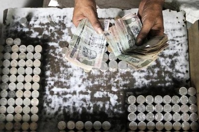 Rupee gains, closes at 61.81 vs US dollar