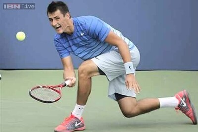 Bernard Tomic digs deep to win tough US Open clash