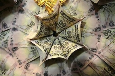 Rupee falls to record low, nears 55 per $