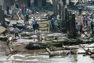 Dam bursts near Indonesian capital, killing 34