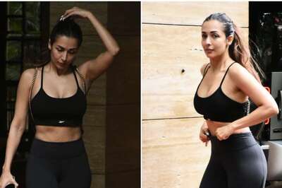 Malaika Arora Papped in Sexy Black Athleisure at Bandra Amidst Heavy Downpour