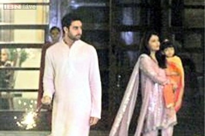 Snapshot: Little Aaradhya looks adorable in a saffron kurta as she hangs out with daddy Abhishek Bachchan