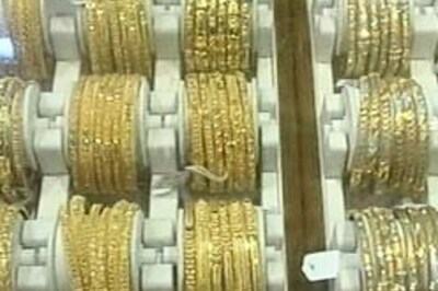 Gold prices rise as dollar drops, crude surges