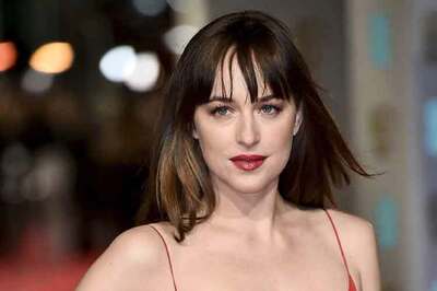 Look of the day: Dakota Johnson oozes oomph in a scarlet Dior gown on BAFTAs red carpet