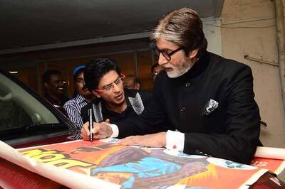 Snapshot: Amitabh signs a poster of 'Don' for SRK