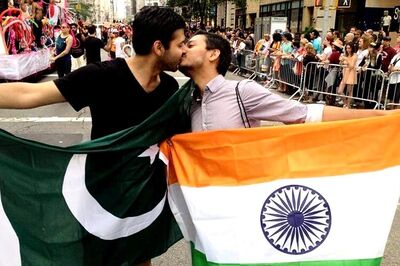 Photo of the day: This picture of a gay couple kissing in Pride is the perfect example of 'make love, not war'