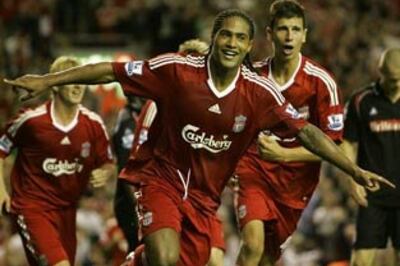 Johnson scores in home debut, Liverpool rout Stoke City