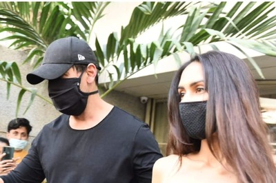 John Abraham Plays the Protective Husband as He Guides Wife Priya Runchal Towards Car Amid Shutterbugs