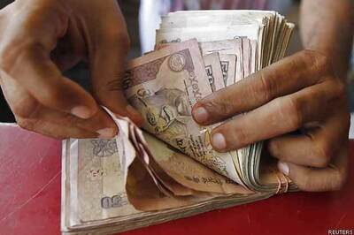 Rupee hits one-week high, opens at 61.94