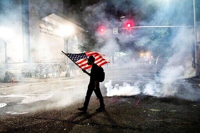 AP PHOTOS: Facing federal agents, Portland protests swell