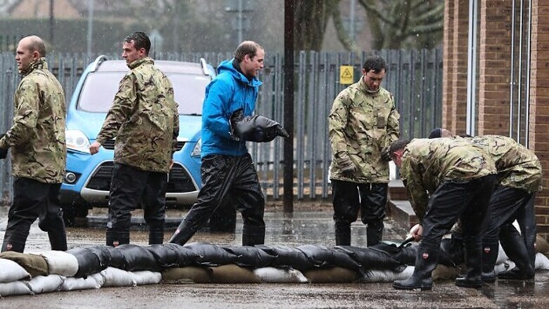 Princes William, Harry sandbag against UK floods