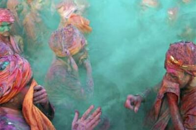 Images:  Colours and sweets, India in full Holi spirit