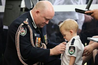With Pacifier in Mouth, Toddler Son Receives Posthumous Medal for Firefighter Killed in Australia Bushfire
