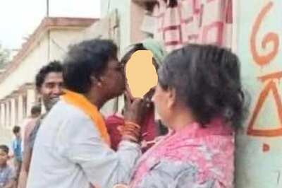 BJP Candidate Khagen Murmu Faces Flak Over Kissing Woman During Poll Campaign in Bengal; TMC Reacts