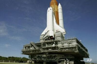 Atlantis heads back to hangar for repair