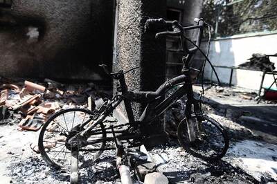 Dolls, Bicycles Among Charred Belongings from Greek Blaze