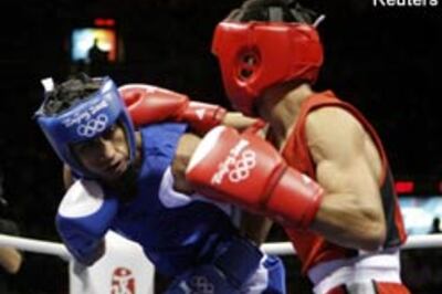 Jitender boxes his way into 51kg quarter-finals