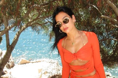Dua Lipa Sizzles In Orange Bikini As She Sunbathes In Kosovo Vacation