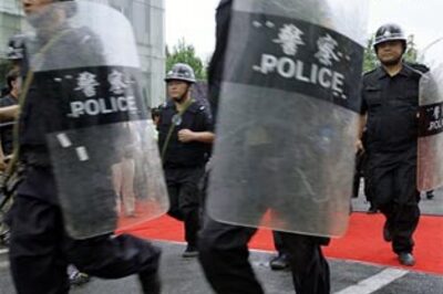 Riot-hit China town calm under shadow of gun