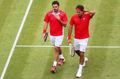 Federer-Wawrinka win gripping doubles opener