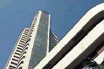 Sensex closes on high despite rains