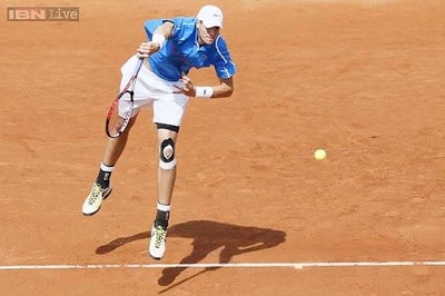 John Isner hits 23 aces in 1st round win at French Open