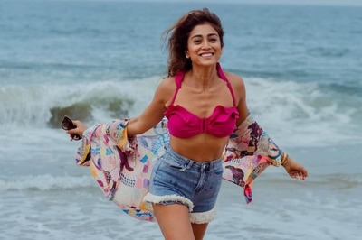 Shriya Saran Looks Stunning In Pink Bikini Top And Blue Denim Shorts On Kovalam Beach