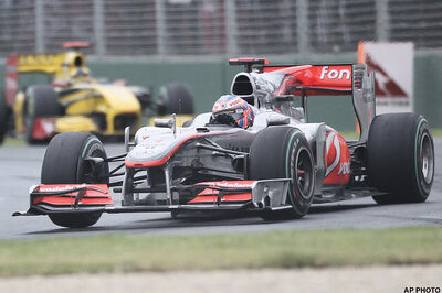 Button wins Australian GP, Vettel crashes
