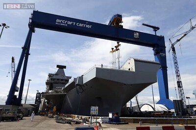 Queen smashes whisky, gives her name to Britain's biggest warship