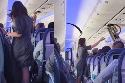 Watch: Delta Flight Attendants Fix Loose Ceiling Panel Mid-Air