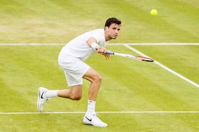Zemlja beats Dimitrov to enter third round at Wimbledon