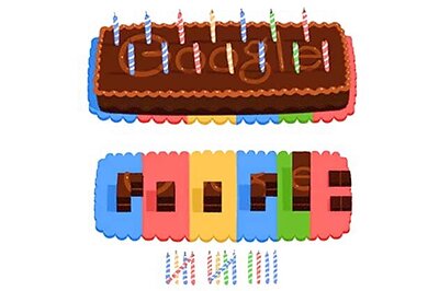 Google doodles cake, candles on its 14th birthday