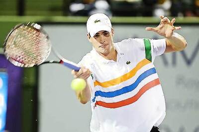 Marathon man John Isner gets quick Wimbledon win