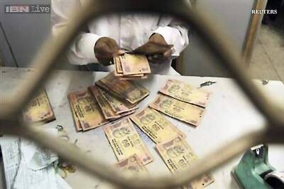 Rupee marginally up at 66.02 against dollar in early trade