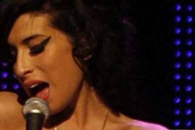 Amy Winehouse performs at Paris Fashion Week