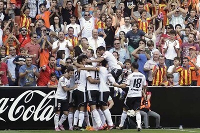 Valencia beat Atletico Madrid 3-1 for provisional lead